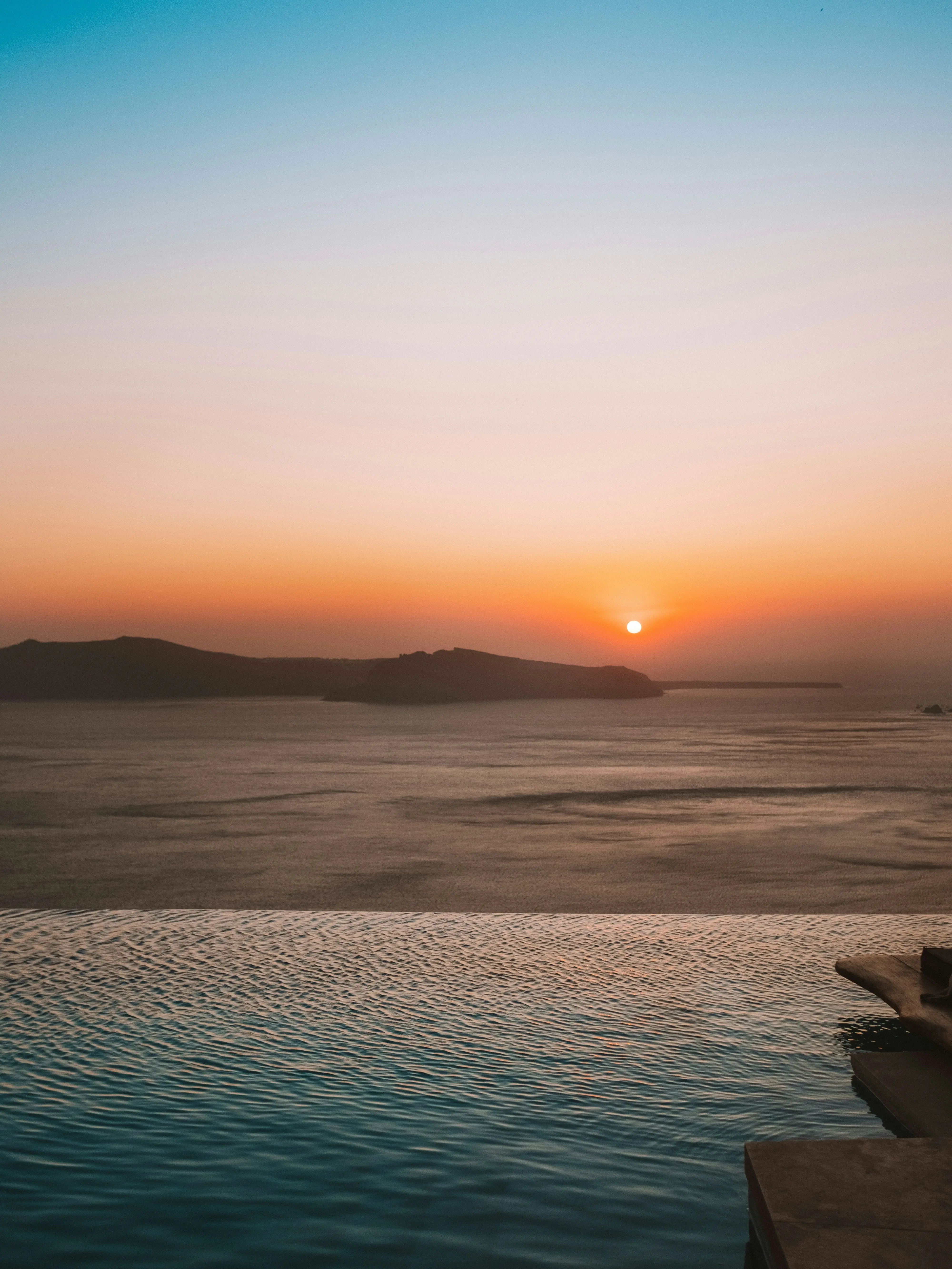 Cinematic sunset over a Greek island horizon